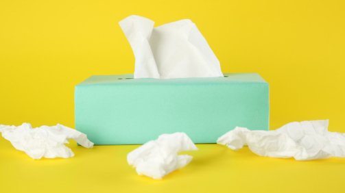 Used,Paper,Tissues,And,Box,On,Yellow,Background