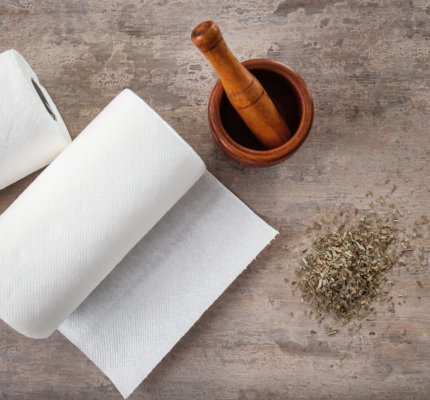 Rolls,Of,Paper,Towels,,Mortar,And,Pestle,On,Kitchen,Table